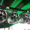 Tower speakers back-lit with green LED lights