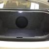 12 inch W3-series JL Audio subwoofer. Panelled off in the trunk.
